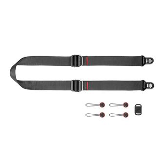 Meilleures sangles pour appareil photo en 2025 : Confort, sécurité & style 1 une sangle avec un fermoir et des boutons